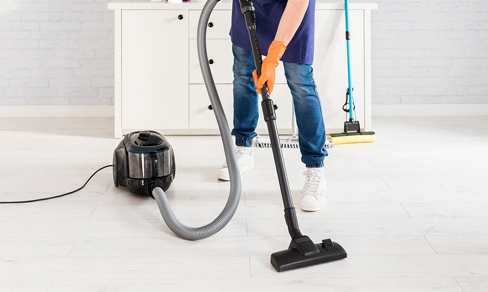 Housekeeper cleaning a hotel room